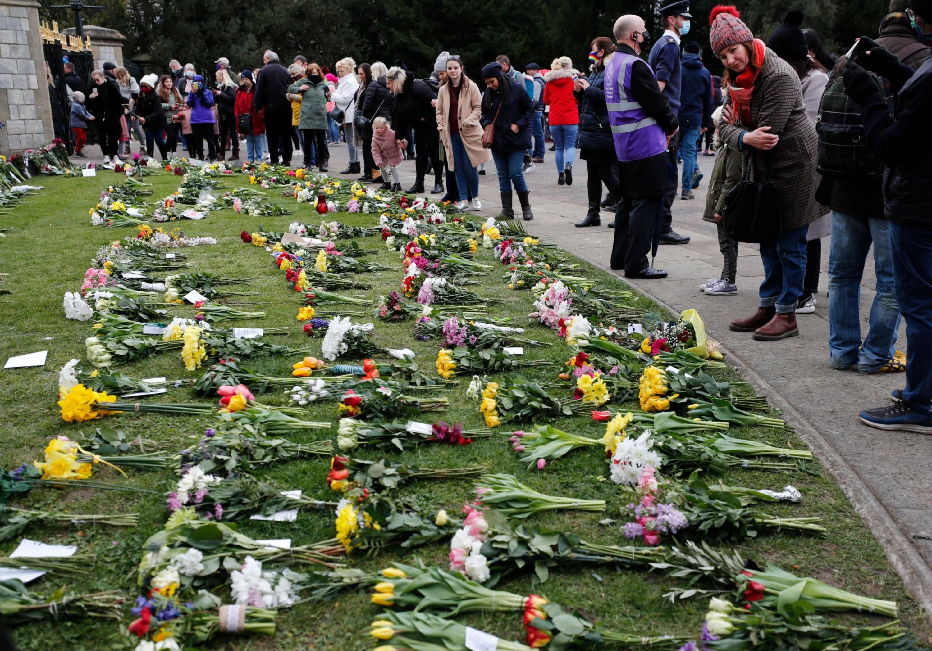 Flowers are left at Windsor Castle's Cambridge Gate on Saturday, April 10.