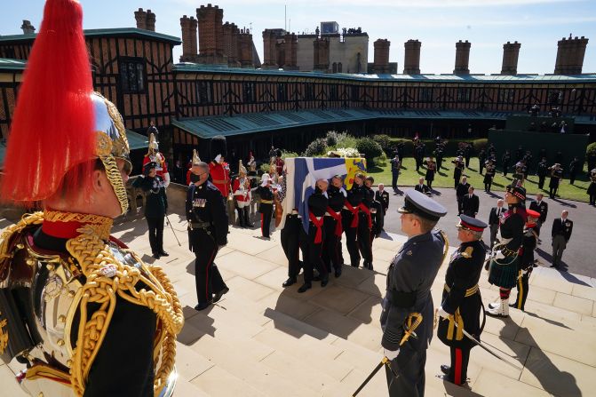 Philip's coffin is carried up the steps of the chapel.