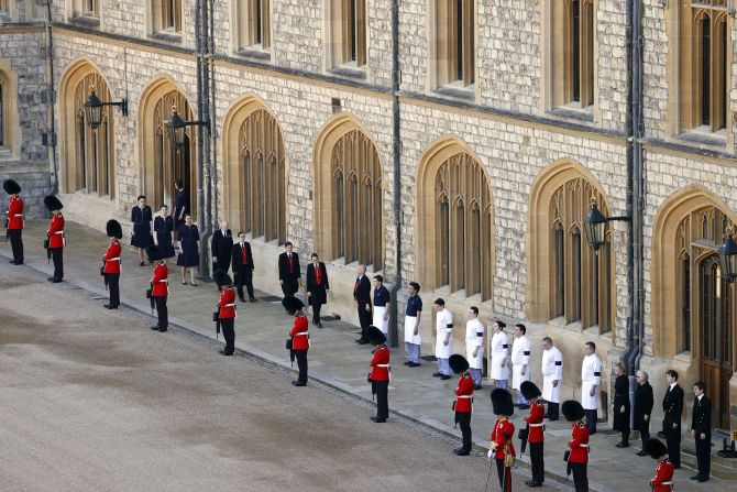 Guardsmen and royal household staff take part in the ceremony.