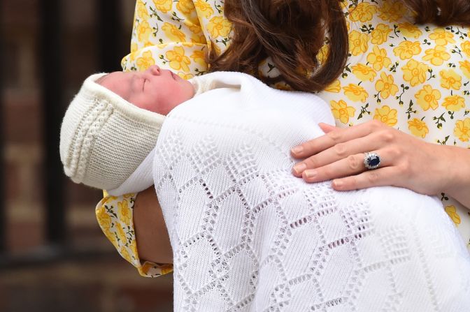 Kate holds newborn Princess Charlotte while speaking to the media outside a London hospital in 2015.