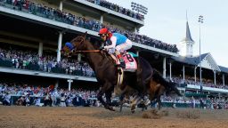 LOUISVILLE, KENTUCKY - MAY 01: Medina Spirit #8, ridden by jockey John Velazquez, (R) crosses the finish line to win the 147th running of the Kentucky Derby ahead of Mandaloun #7, ridden by Florent Geroux, and Hot Rod Charlie #9 ridden by Flavien Prat , and Essential Quality #14, ridden by Luis Saez, at Churchill Downs on May 01, 2021 in Louisville, Kentucky. (Photo by Tim Nwachukwu/Getty Images)