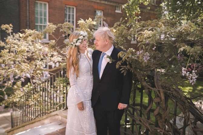 Johnson is seen with his wife, Carrie, after <a href="https://www.cnn.com/2021/05/29/world/boris-johnson-marries-carrie-symonds-intl/index.html" target="_blank">their wedding</a> at London's Westminster Cathedral in May 2021. The ceremony, described by PA Media as a "secret wedding," was reportedly held in front of close friends and family, according to several British newspaper accounts.