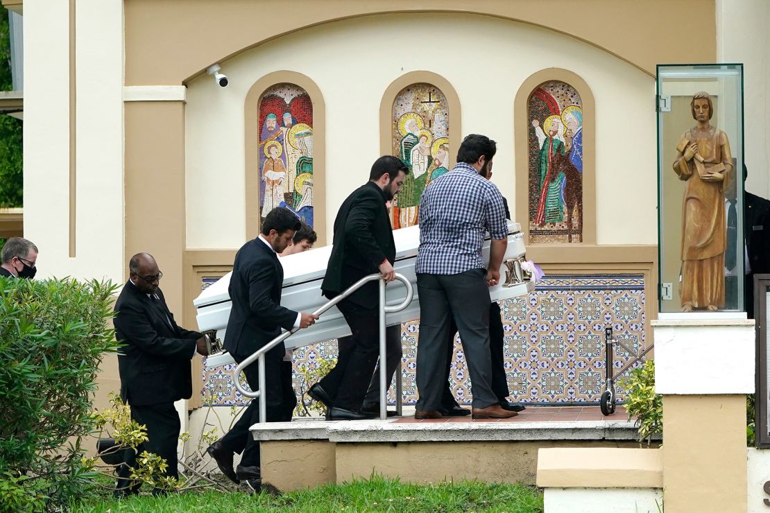 Pallbearers carry the shared casket of sisters Lucia and Emma Guara before their family's funeral service in Miami Beach on July 6.