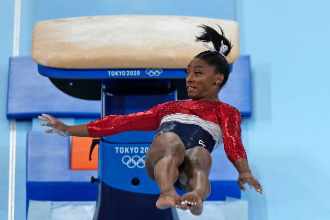 Biles lands awkwardly while competing in the team all-around at the Tokyo Olympics in July 2021. Biles stumbled on the vault landing and then <a href="https://www.cnn.com/world/live-news/tokyo-2020-olympics-07-27-21-spt/h_fbc139e365a8d111304aa45ddd4ed62b" target="_blank">pulled out of the competition</a> over mental-health concerns.