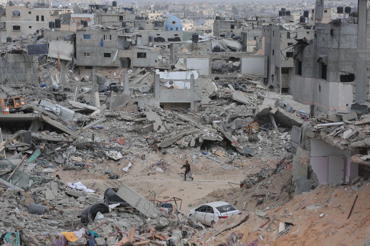 A person walks through rubble in Khan Younis on Wednesday.