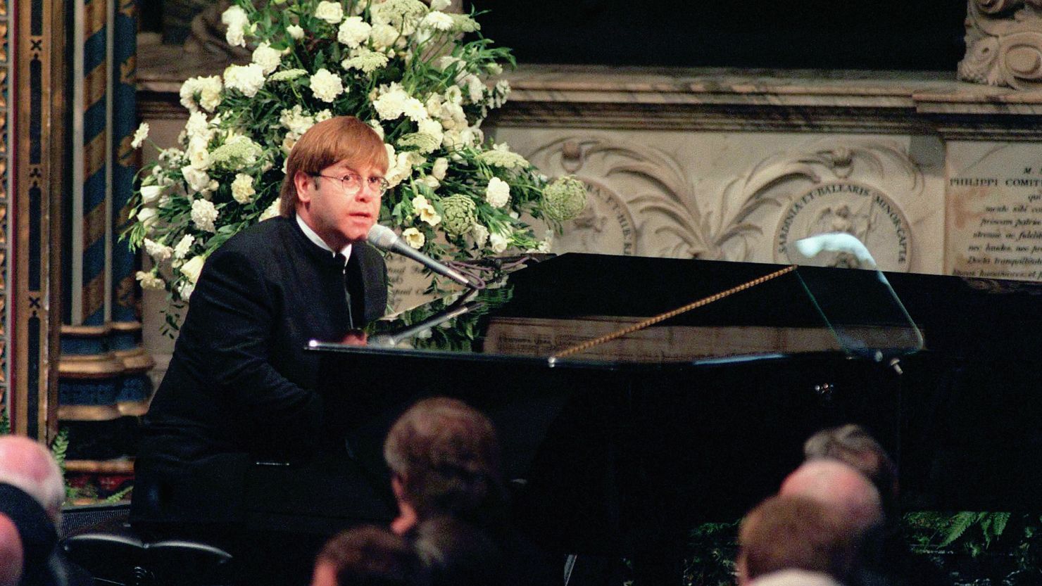 Elton John pictured singing at the funeral of Princess Diana on September 6, 1997.