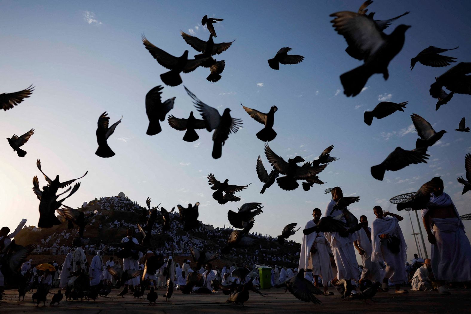 Muslims taking part in the annual Hajj pilgrimage gather at the Mount of Mercy, on the plain of Arafat outside the holy city of Mecca, Saudi Arabia, on Saturday, June 15.