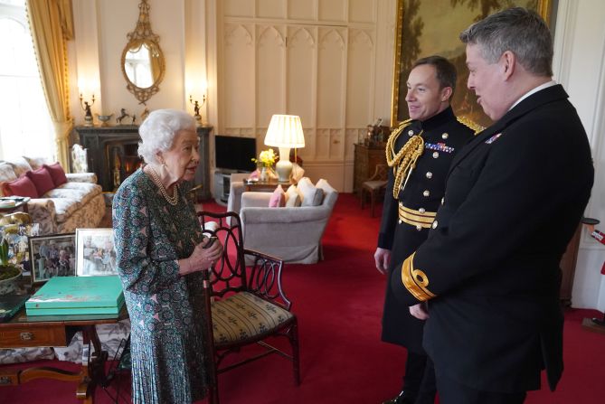 The Queen meets with Rear Admiral James Macleod, the outgoing Defence Services secretary, and Macleod's successor, Major General Eldon Millar, at Windsor Castle in February 2022. It was a few days before Buckingham Palace announced that the Queen <a href="https://www.cnn.com/2022/02/20/uk/queen-elizabeth-coronavirus-intl-gbr/index.html" target="_blank">tested positive for Covid-19.</a>
