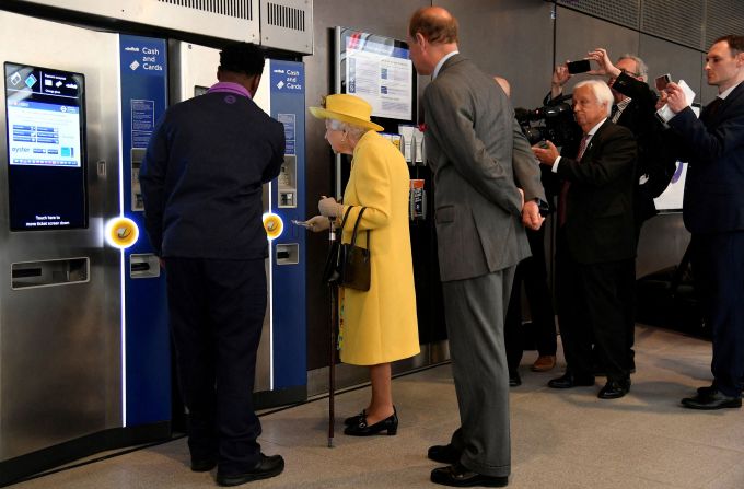 The Queen purchases a train ticket as she attends <a href="http://edition.cnn.com/travel/article/queen-elizabeth-train-line-london-intl-scli-gbr/index.html" target="_blank">the opening ceremony of the long-awaited Elizabeth line</a> at the Paddington station in west London in May 2022. She had recently been suffering from mobility issues, canceling several appearances.