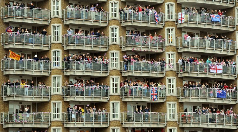 Balconies of apartment blocks along the Thames are packed with royal-watchers.