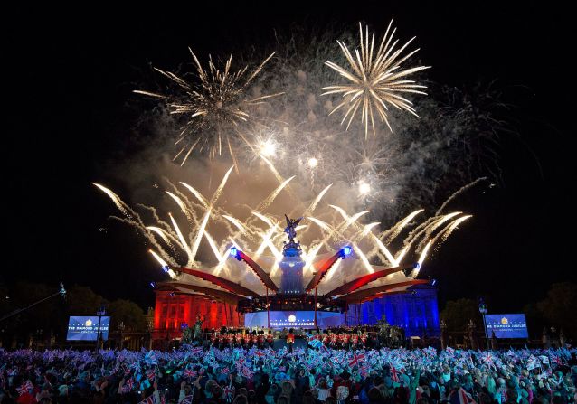 Fireworks light up the palace during a star-studded Diamond Jubilee concert organized by Take That singer and songwriter Gary Barlow. The Queen made a regal appearance but without Prince Philip, who <del> </del>was <a href="https://edition.cnn.com/2012/06/09/world/europe/uk-prince-philip/index.html" target="_blank">hospitalized</a> just hours earlier. 