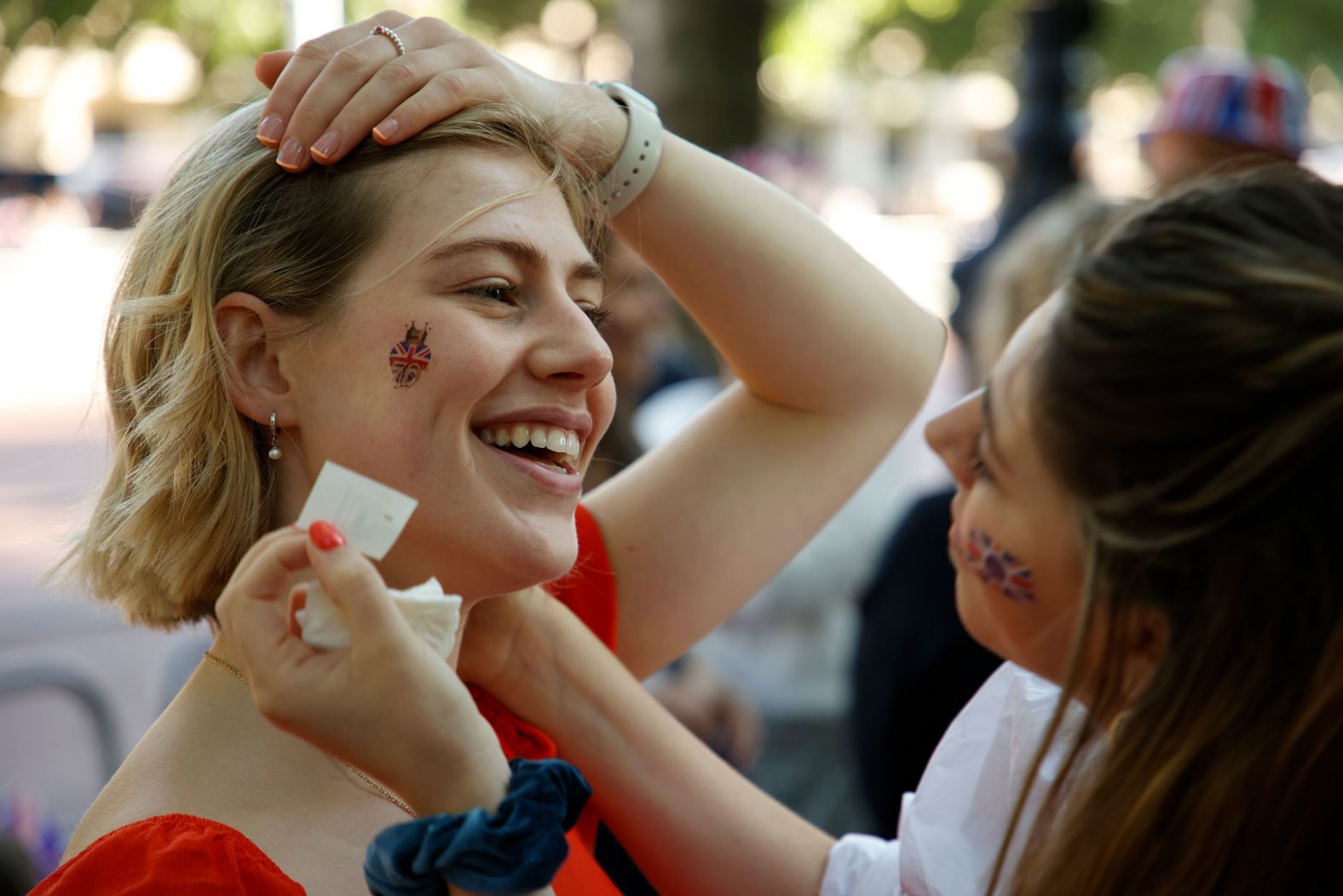 Some royal fans had Union flags applied to their faces as they gathered along The Mall in London on Thursday.