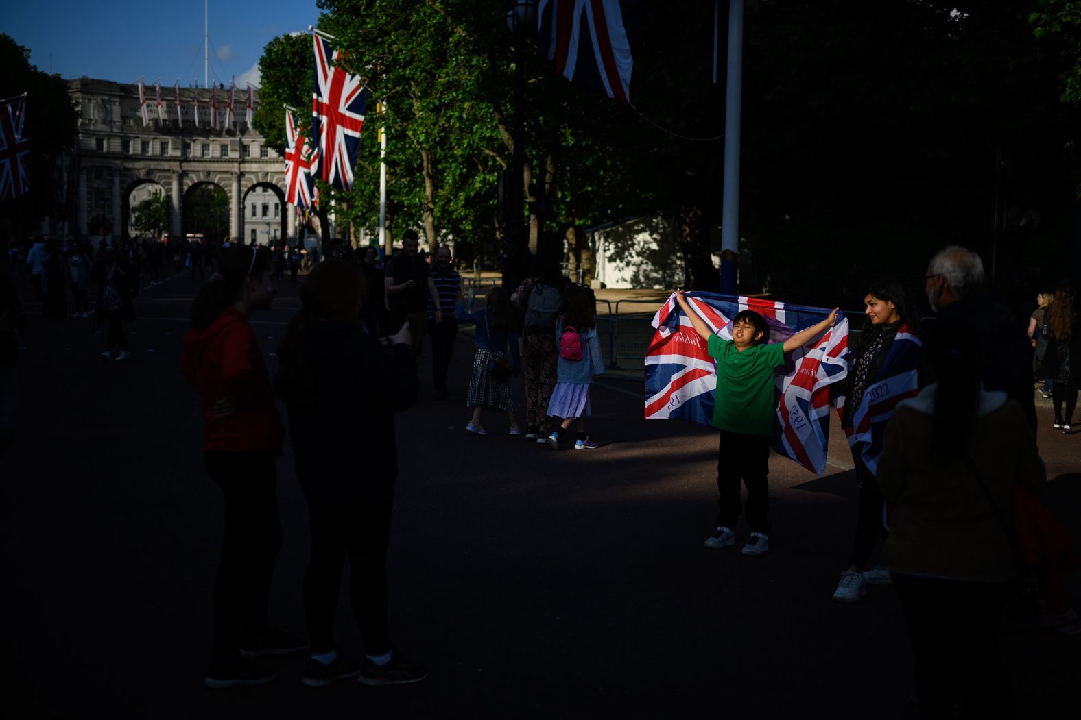 A boy poses with a Union flag on The Mall on Wednesday.