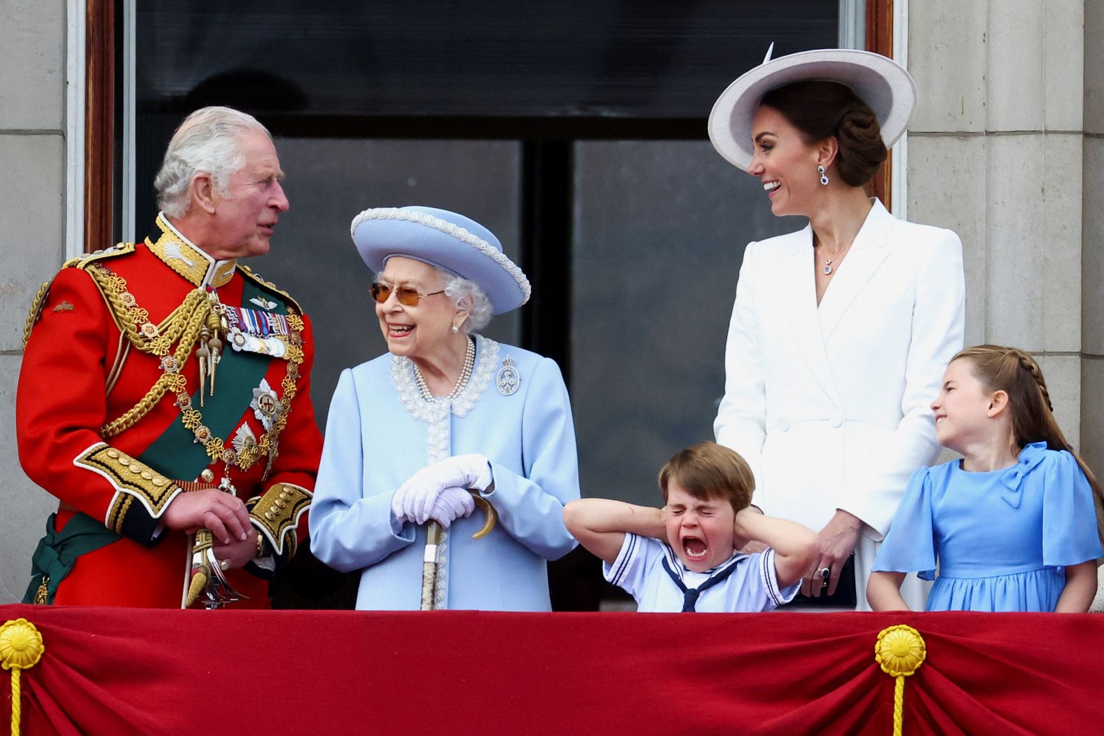 The Queen's great-grandson <a href="https://www.cnn.com/europe/live-news/queen-elizabeth-platinum-jubilee-06-02-22-intl-scli-gbr/h_45aa76232ed00d50482df7476c5f422a" target="_blank">Prince Louis holds his hands over his ears</a> during the six-minute flypast staged by the Royal Air Force. From left are Prince Charles; the Queen; Prince Louis; Catherine, the Duchess of Cambridge; and Princess Charlotte.