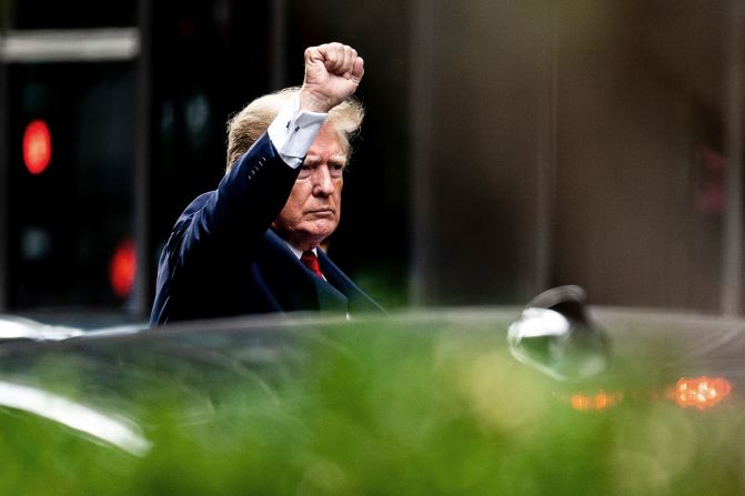 Trump gestures as he departs Trump Tower in New York in August 2022. He was on his way to the New York attorney general's office, where <a href="https://www.cnn.com/2022/08/10/politics/trump-deposition-ny-attorney-general/index.html" target="_blank">he invoked the Fifth Amendment</a> at a scheduled deposition. Trump was to be deposed as part of a more than three-year civil investigation into whether the Trump Organization misled lenders, insurers and tax authorities by providing them misleading financial statements. Trump and the Trump Organization have previously denied any wrongdoing.