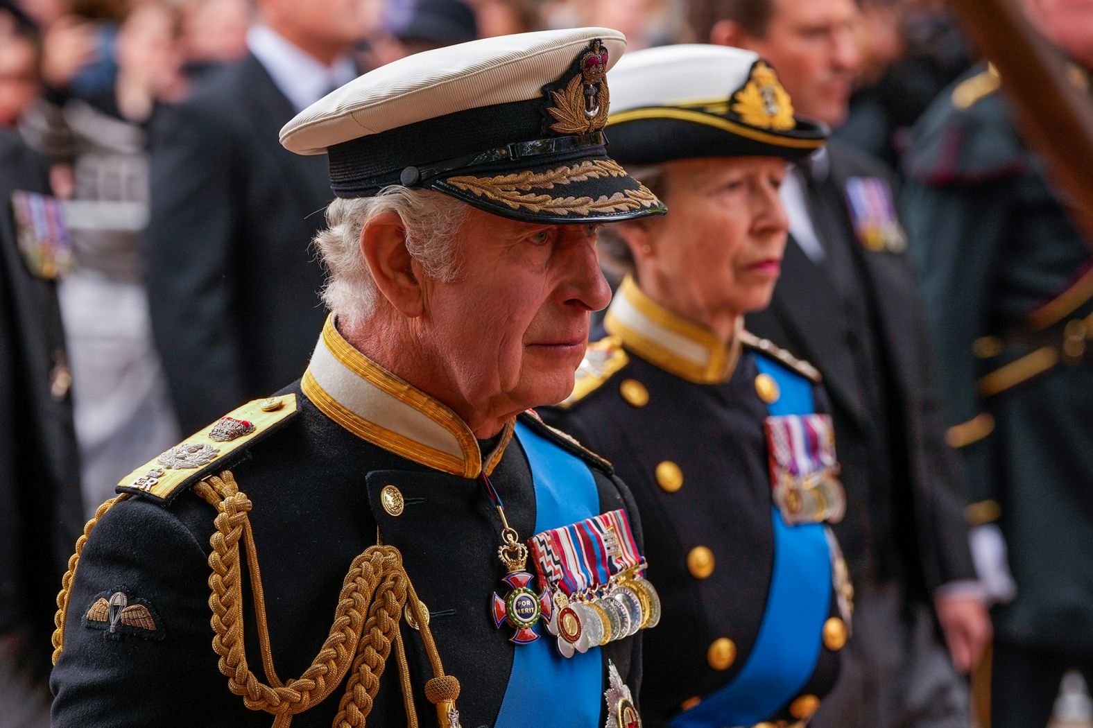 The King and his sister, Princess Anne, follow the Queen's coffin after Monday's funeral service.