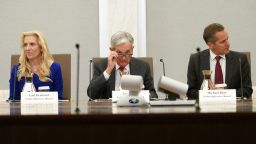 Flanked by Vice Chairs of the Board of Governors of the Federal Reserve Lael Brainard and Michael Barr,  Federal Reserve Board Chairman Jerome Powell delivers opening remarks to the "Fed Listens: Transitioning to the Post-pandemic Economy" event in  Washington, U.S., September 23, 2022. 