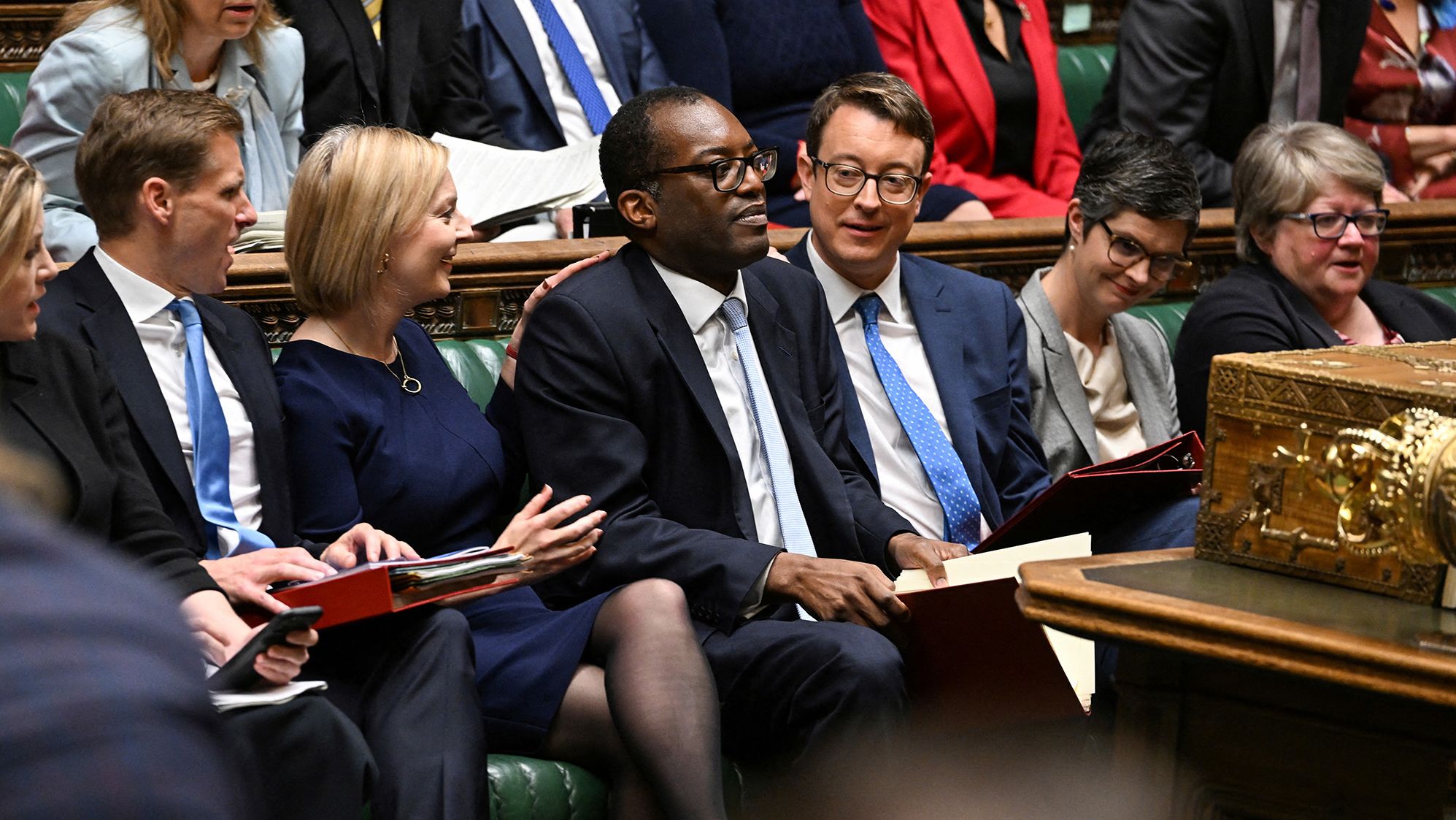 Truss and Chancellor of the Exchequer Kwasi Kwarteng, center, deliver the Government's Growth Plan statement at the House of Commons in September 2022. Kwarteng announced a controversial mini-budget full of unfunded tax-cutting measures <a href="https://www.cnn.com/2022/10/13/uk/liz-truss-ousting-analysis-intl-gbr/index.html" target="_blank">that sent financial markets into meltdown.</a> At one point, the pound sank to its lowest level against the dollar in decades. He was relieved of his duties weeks later.