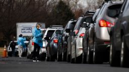 DENVER, CO - MARCH 12: Healthcare workers from the Colorado Department of Public Health and Environment check in with people waiting to be tested for COVID-19 at the state's first drive-up testing center on March 12, 2020 in Denver, Colorado. The testing center is free and available to anyone who has a note from a doctor confirming they meet the criteria to be tested for the virus. (Photo by Michael Ciaglo/Getty Images)