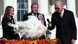 WASHINGTON, DC - NOVEMBER 21: U.S. President Joe Biden pardons Chocolate, the National Thanksgiving Turkey, as he is joined by the 2022 National Turkey Federation Chairman Ronnie Parker and Alexa Starnes, daughter of the owner of Circle S Ranch, on the South Lawn of the White House November 21, 2022 in Washington, DC. Chocolate, and the alternate, Chip, were raised at Circle S. Ranch, outside of Charlotte, North Carolina, and will reside on the campus of North Carolina State University following today's ceremony. (Photo by Win McNamee/Getty Images)