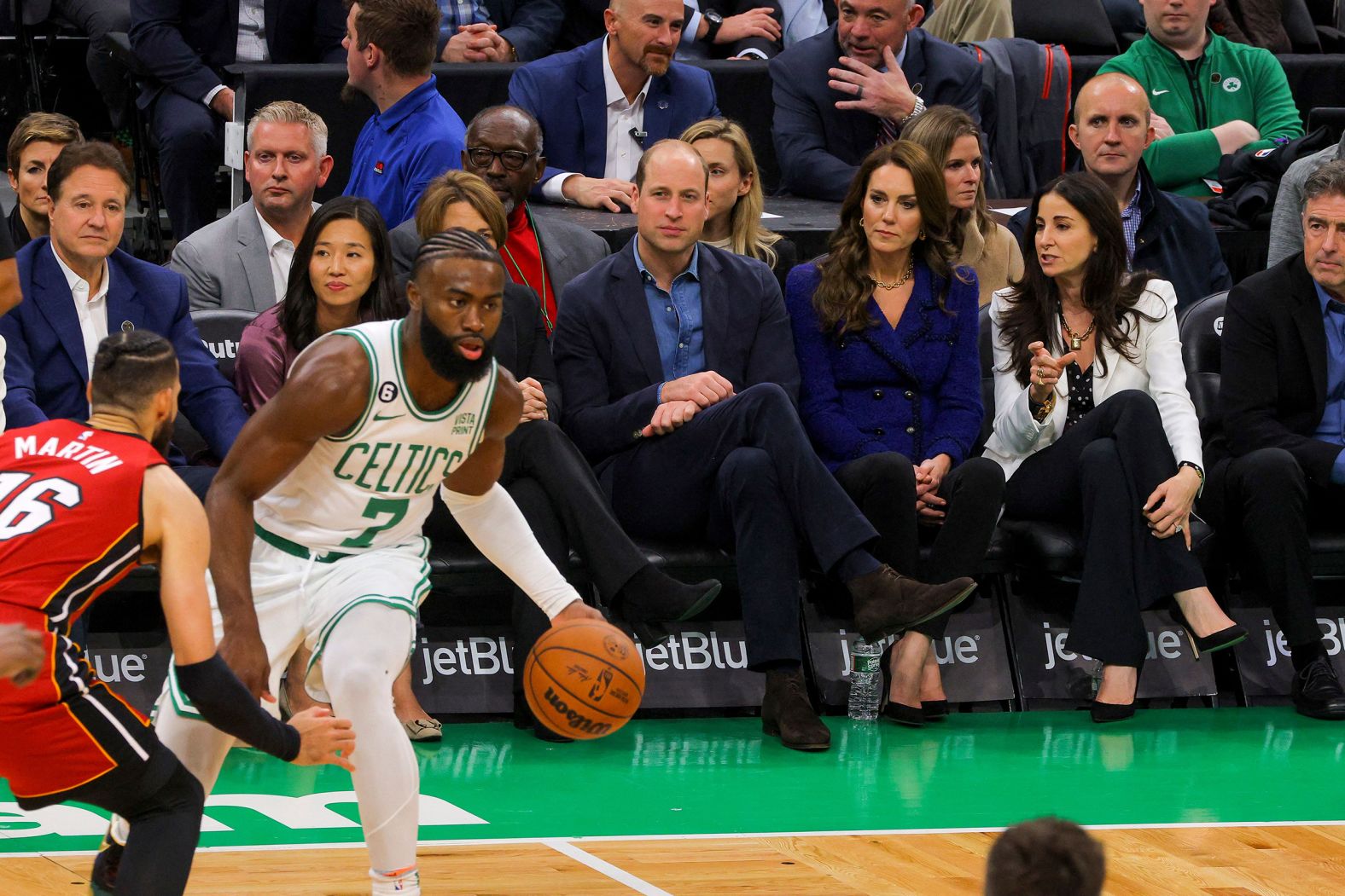 The royal couple watches an NBA game on Wednesday.