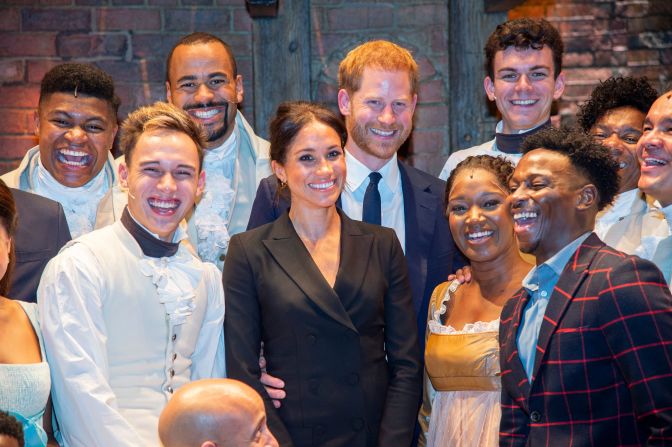 Meghan and Harry pose with the cast and crew of the musical "Hamilton" after a performance in London in August 2018. Harry gave those in the theater something to remember after <a href="https://www.cnn.com/2018/08/30/uk/prince-harry-meghan-markle-hamilton-intl/index.html" target="_blank">breaking into mock-song</a> at the end of the show. The show was held to raise money for his HIV charity, Sentebale.