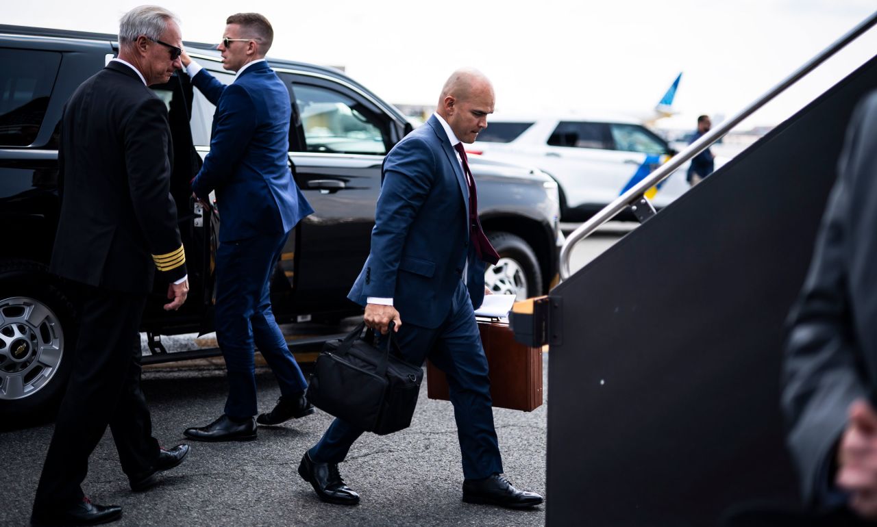Walt Nauta follows former President Donald Trump as they board his airplane in Newark, New Jersey, on Saturday.