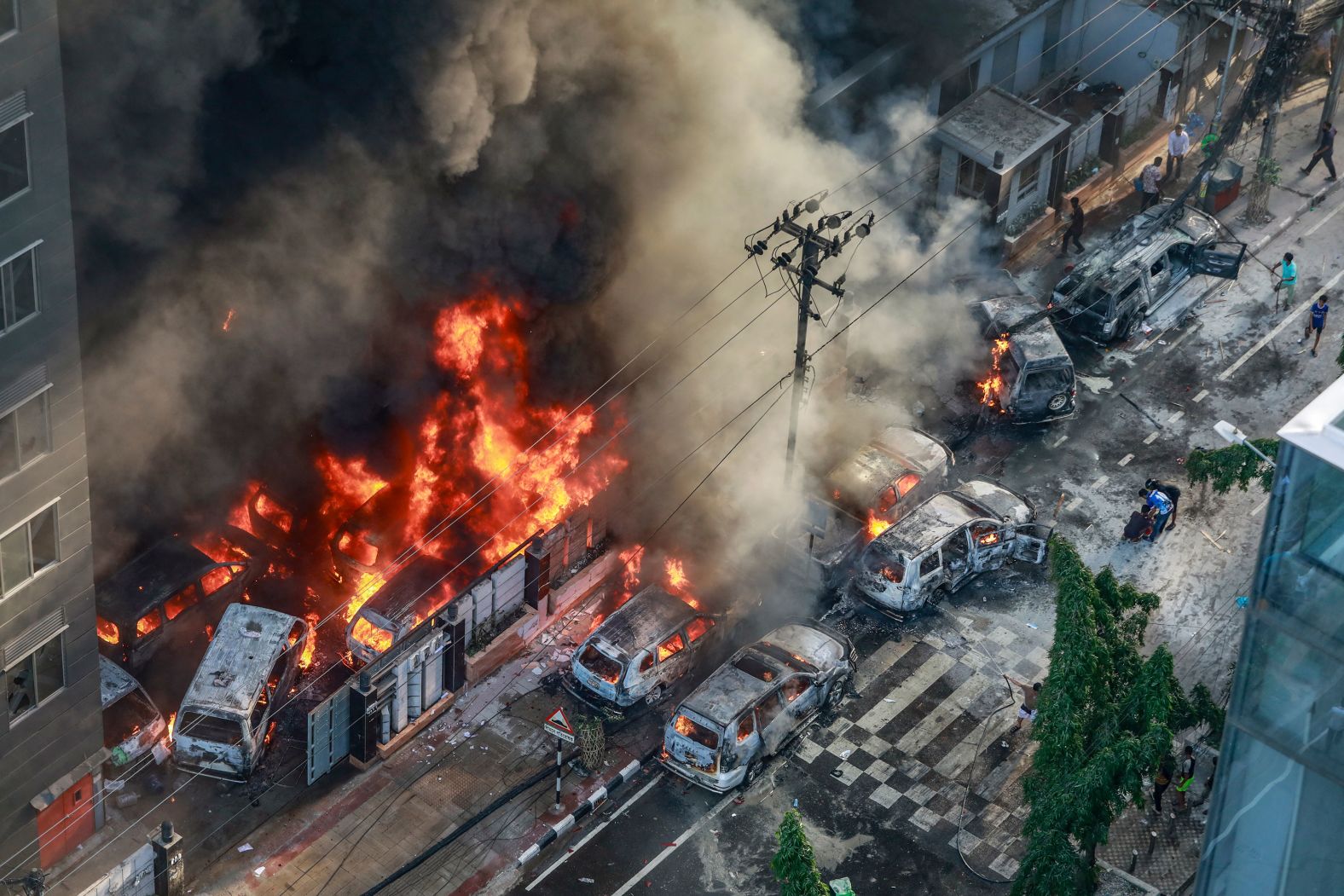 Smoke rises from burning vehicles after protesters set them on fire in Dhaka, Bangladesh, on Thursday, July 18. Huge protests across Bangladesh <a href="https://www.cnn.com/2024/07/19/asia/bangladesh-job-quota-protests-explainer-intl-hnk/index.html">escalated into deadly violence</a>, with clashes between students, pro-government supporters and armed police fueling widespread anger over civil service job quotas that opponents say are discriminatory.