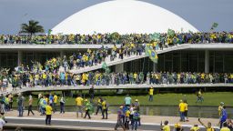 Protesters, supporters of Brazil's former President Jair Bolsonaro, storm the the National Congress building in Brasilia, Brazil, Sunday, Jan. 8, 2023. (AP Photo/Eraldo Peres)