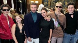 PARIS, FRANCE - SEPTEMBER 30: (L-R) Cruz Beckham, Harper Beckham, David Beckham, Victoria Beckham, Romeo Beckham,  Brooklyn Beckham and Nicola Peltz Beckham attends the Victoria Beckham Spring/summer 2023 Runway show in Val-de-Grace on September 30, 2022 in Paris, France. (Photo by Darren Gerrish/WireImage for Victoria Beckham )