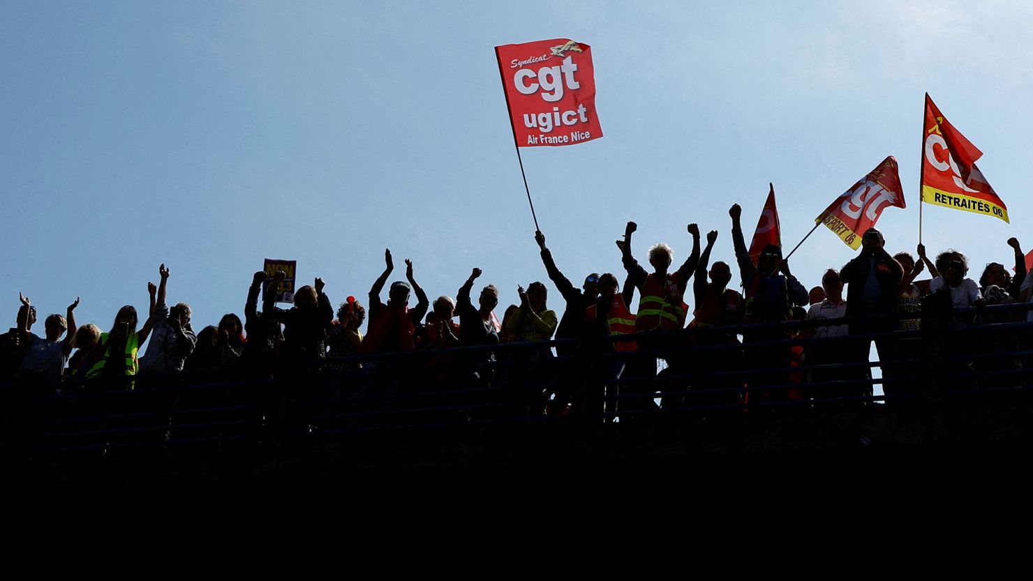 Protesters, holding CGT labor union flags, attend a demonstration against the pension reform in Nice, France, on March 23, 2023.      