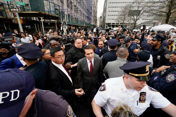 Trump attorney Todd Blanche, center, leaves the courthouse on April 4, 2023.