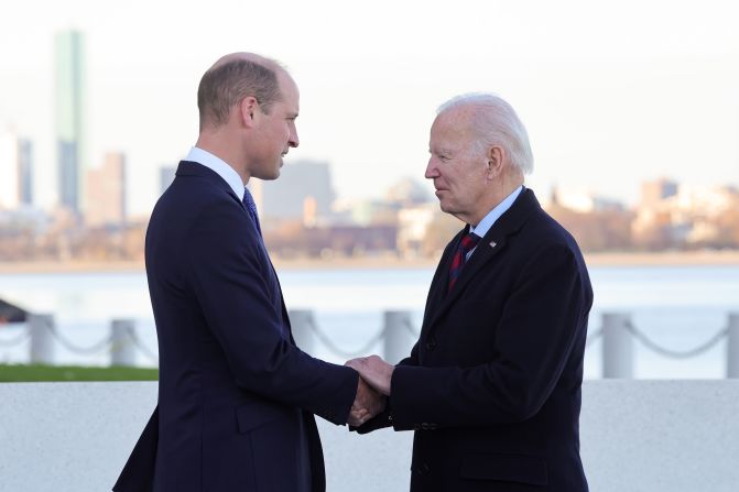 Prince William shakes hands with US President Joe Biden during a <a href="https://www.cnn.com/2022/12/01/world/gallery/royals-boston-visit-william-kate/index.html" target="_blank">visit to Boston</a> in December 2022. The two men shared "warm memories" of the Queen, according to Kensington Palace. William and Catherine were in Boston to attend the Earthshot Prize Awards that William founded two years prior.