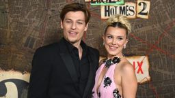 Jake Bongiovi (L) and British actress Millie Bobby Brown arrive for the premiere of Netflix's "Enola Holmes 2" at The Paris Theatre in New York City on October 27, 2022.