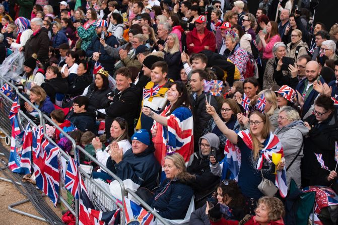 People line the procession route in London.