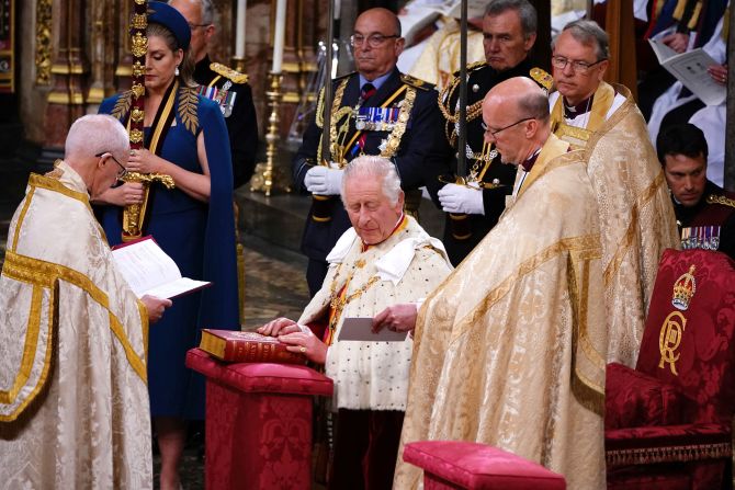The King places his hands on the Coronation Bible as he <a href="https://www.cnn.com/uk/live-news/king-charles-iii-coronation-ckc-intl-gbr/h_329d6fba5cd3c92110395f5152360553" target="_blank">takes the Coronation Oath</a>.