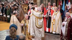 King Charles III sits as he receives The St Edward's Crown during the coronation ceremony at Westminster Abbey, London, Saturday, May 6, 2023. (Jonathan Brady/Pool Photo via AP)