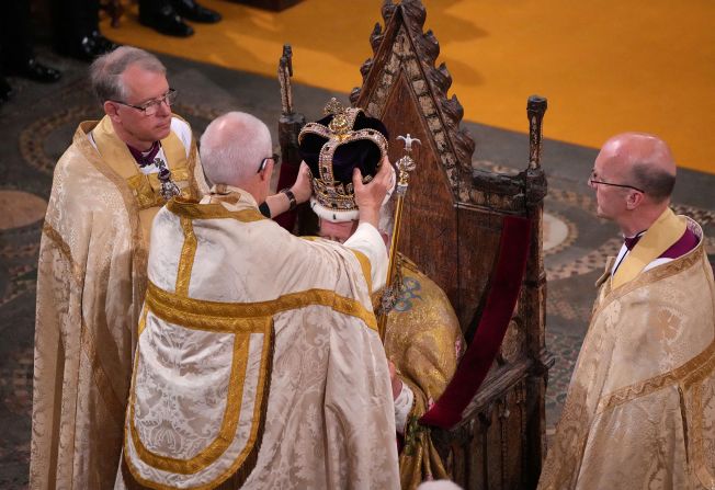 The Archbishop of Canterbury Justin Welby <a href="https://www.cnn.com/uk/live-news/king-charles-iii-coronation-ckc-intl-gbr/h_0a26f9200f7038d529cbcb8cb39e0871" target="_blank">places the St. Edward's Crown onto the head of the King</a>.