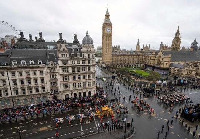 The Gold State Coach carries the King and Queen back to Buckingham Palace.