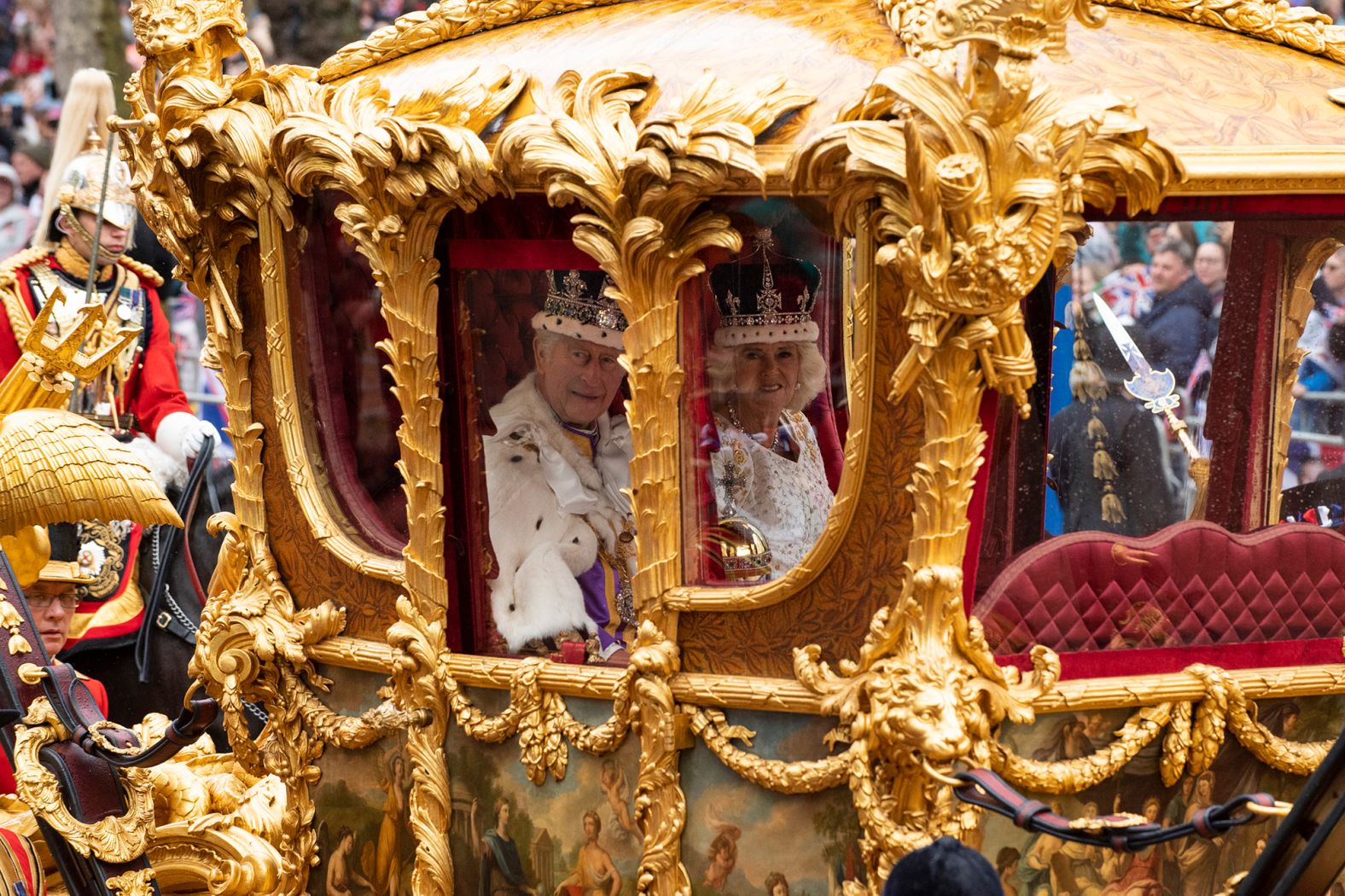 Charles and Camilla travel to Buckingham Palace after the coronation ceremony.