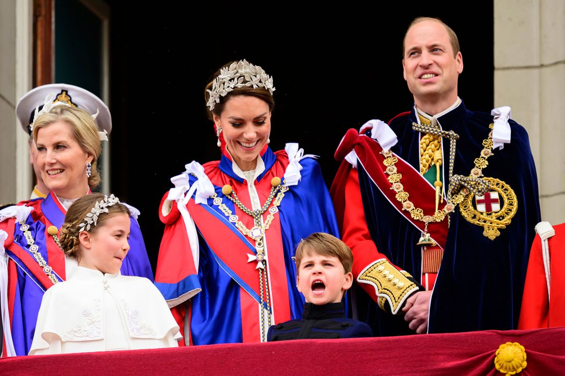 The Wales family greeting the public from the balcony at Buckingham Palace.