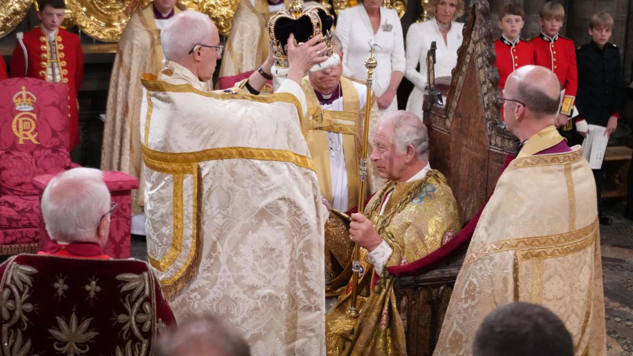 LONDON, ENGLAND - MAY 06: King Charles III is crowned with St Edward's Crown by The Archbishop of Canterbury the Most Reverend Justin Welby during his coronation ceremony in Westminster Abbey, on May 6, 2023 in London, England. The Coronation of Charles III and his wife, Camilla, as King and Queen of the United Kingdom of Great Britain and Northern Ireland, and the other Commonwealth realms takes place at Westminster Abbey today. Charles acceded to the throne on 8 September 2022, upon the death of his mother, Elizabeth II. (Photo by Victoria Jones - WPA Pool/Getty Images)