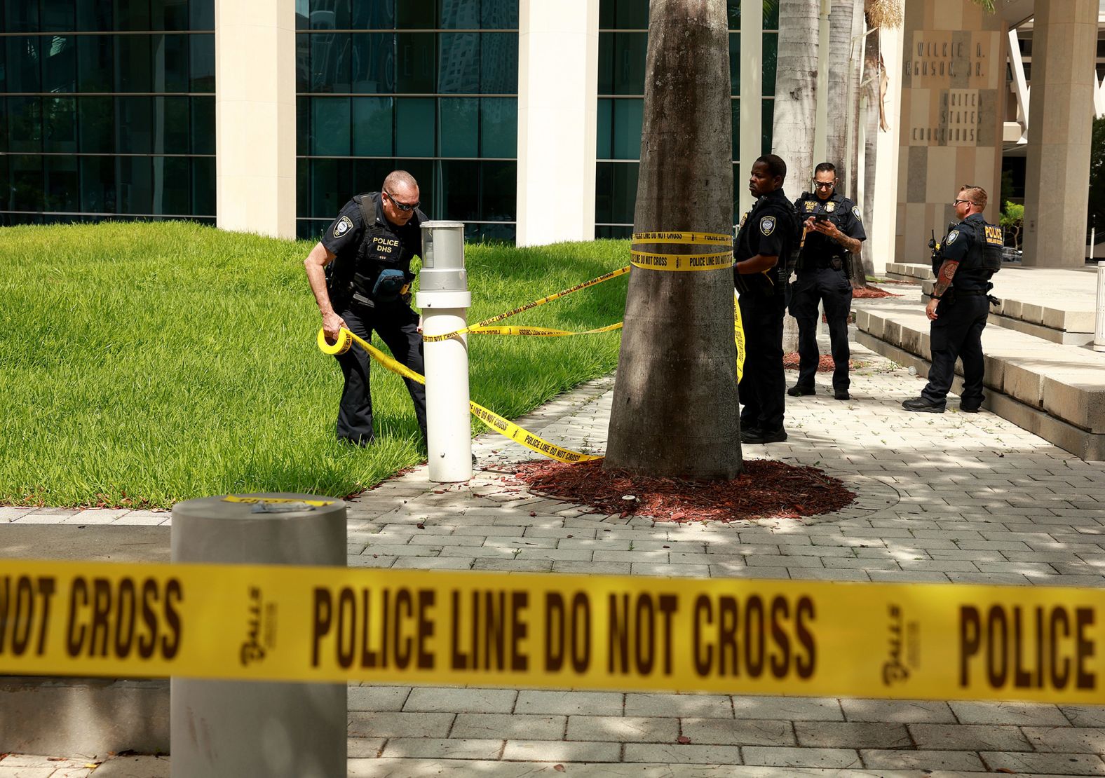 Police place tape in front of the courthouse in Miami.