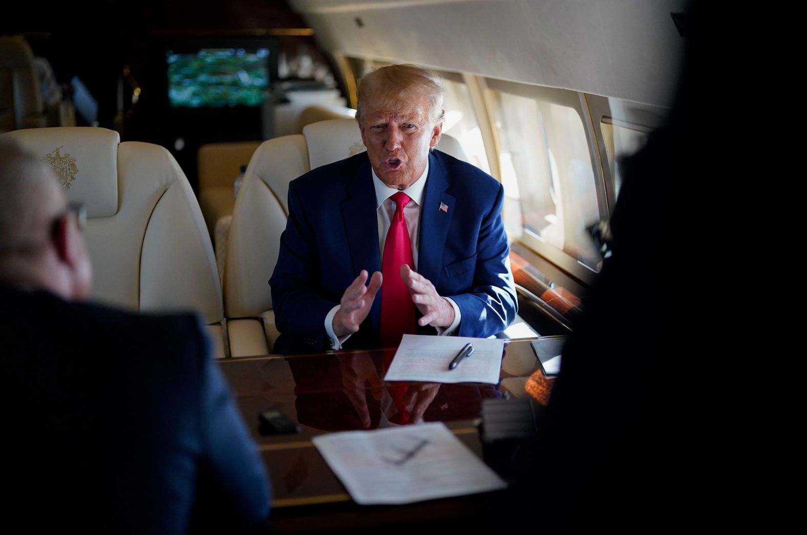 Trump speaks to staff while flying from Georgia to North Carolina on June 10.