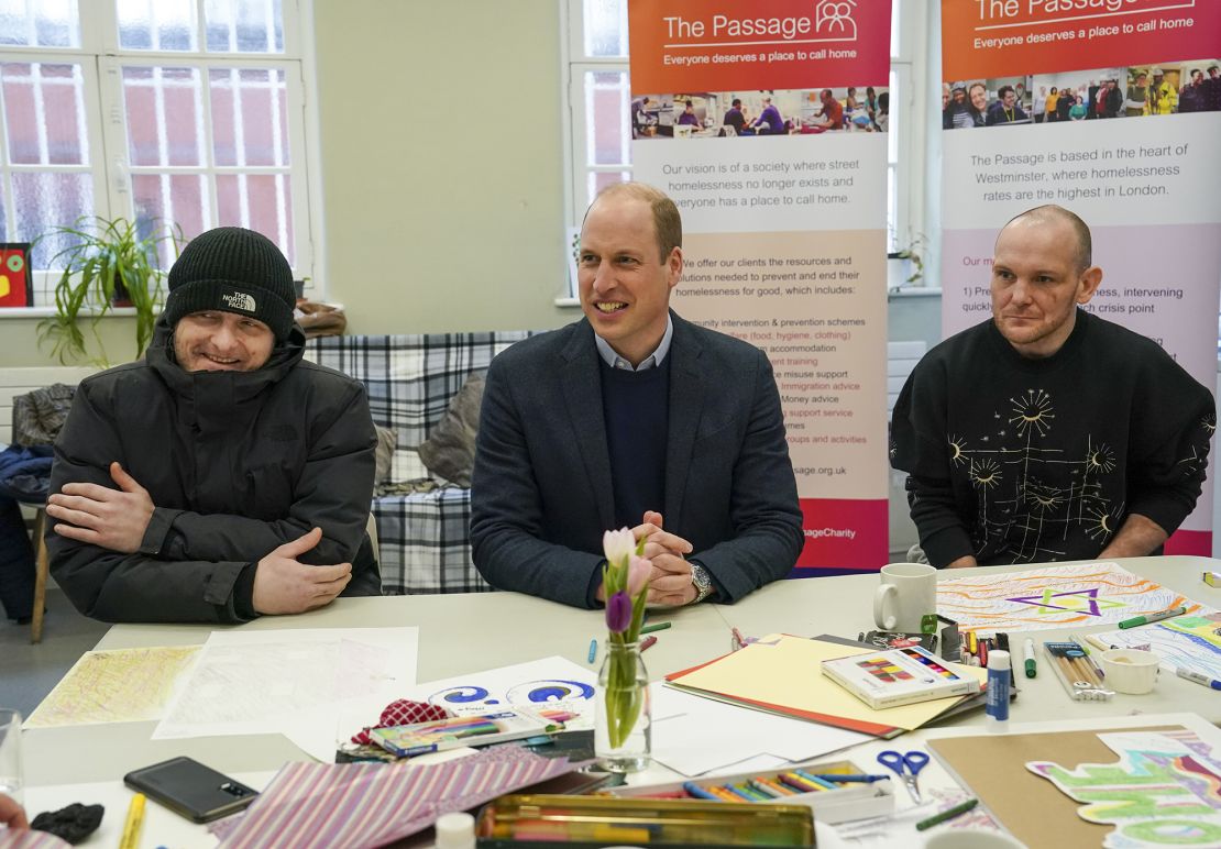 William sits with residents Gary and Marc during a visit to London homeless charity The Passage on February 23, 2023. 