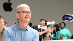 Apple CEO Tim Cook speaks with members of the media next to Apple's new Vision Pro virtual reality headset, during Apple's Worldwide Developers Conference (WWDC) at the Apple Park campus in Cupertino, California, on June 5, 2023. Apple on Monday unveiled its first-ever virtual reality headset challenging Facebook-owner Meta in a market that has yet to tempt users beyond videogamers and tech geeks. The release was the most significant product launch by the iconic iPhone maker since it unveiled the Apple Watch in 2015. 