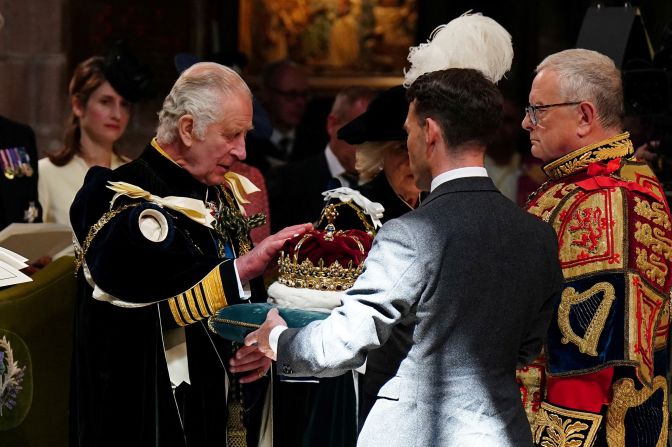 Charles is presented with the Crown of Scotland during a service of thanksgiving that was held at the St. Giles' Cathedral in Edinburgh, Scotland, in July 2023. Scotland was celebrating the King's recent coronation with a <a href="https://www.cnn.com/2023/07/05/europe/scotland-marks-coronation-charles-royals-gbr-intl/index.html" target="_blank">day of festivities</a>.