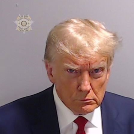 This <a href="https://www.cnn.com/2023/08/24/politics/trump-mug-shot-analysis/index.html" target="_blank">booking photo</a> of Trump was taken in Atlanta in August 2023. Trump was booked on more than a dozen charges stemming from his efforts to reverse Georgia's 2020 election results. His booking number was P01135809. He is the first former US president with a mug shot.