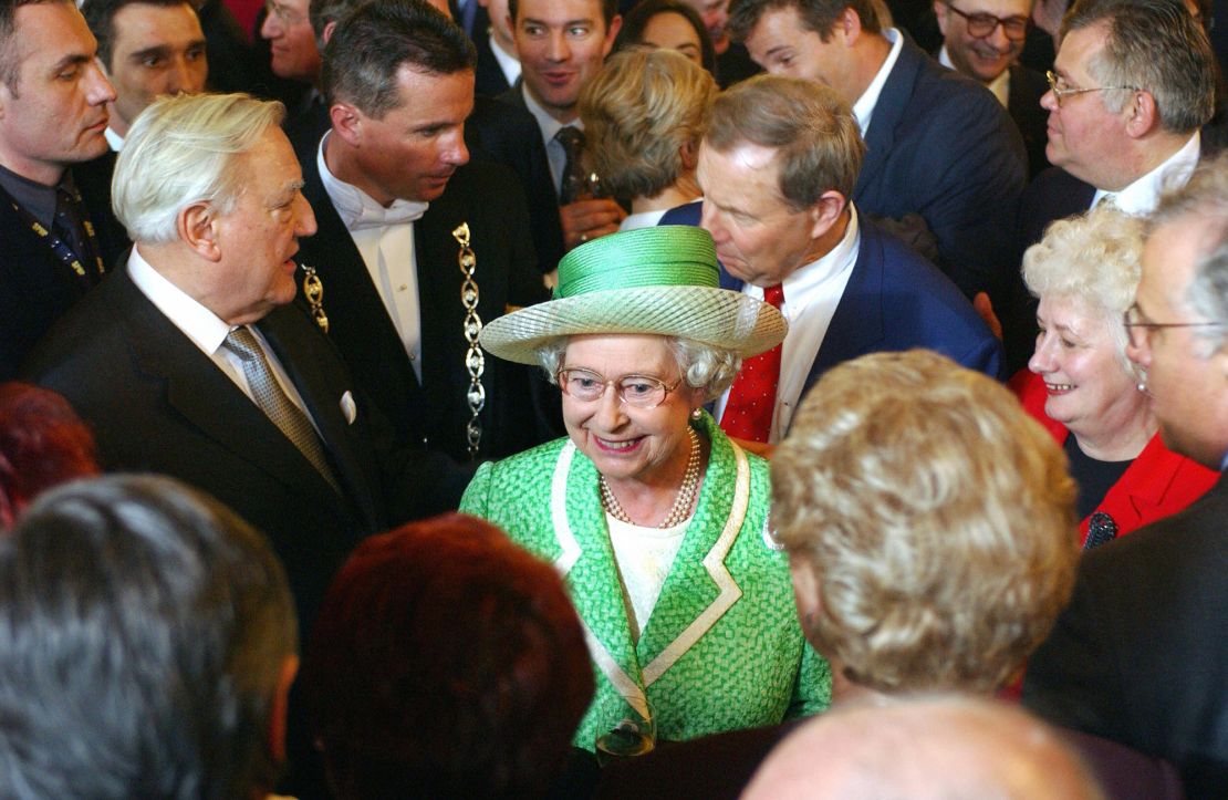 Queen Elizabeth II greets politicians with French Senate Speaker Christian Poncelet, left, in Paris in 2004. 