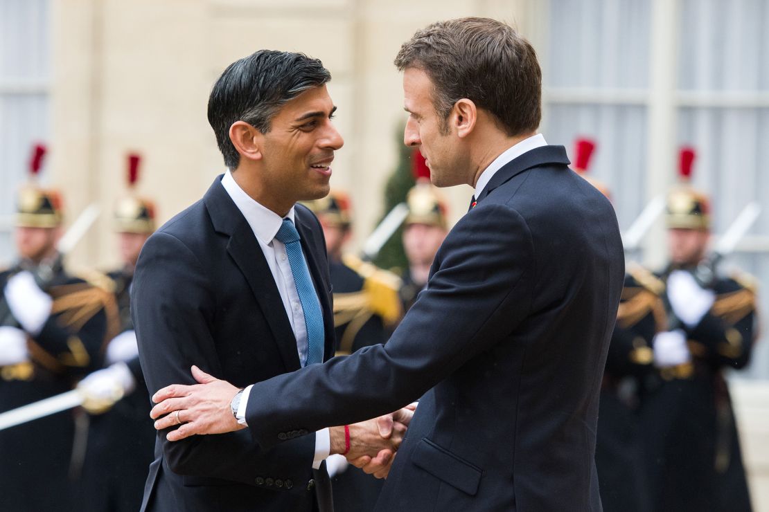 France's Emmanuel Macron greets UK Prime Minister Rishi Sunak ahead of their bilateral meeting at the Elysee Palace in Paris on March 10, 2023.